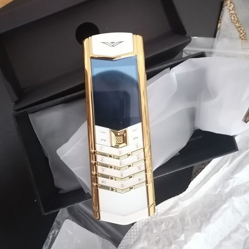 Vertu phone new, gold with metal leather body and dual card slot