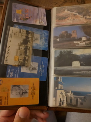 Phone card album used with 73 telecards