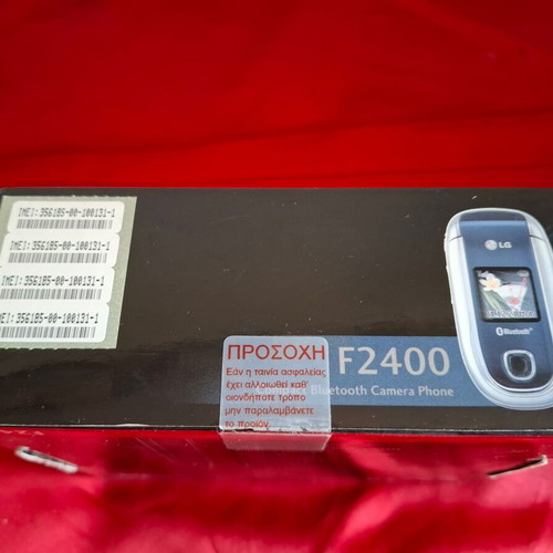 LG F2400 mobile phone packaging like new with charger and manual