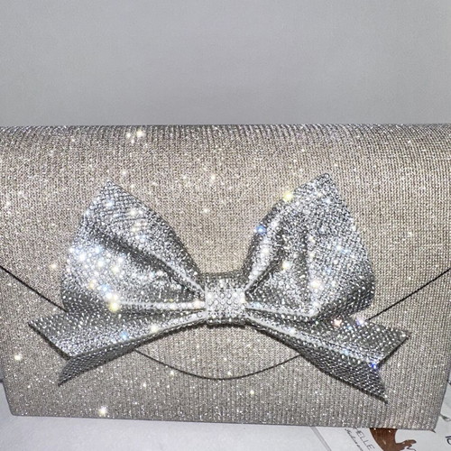 Silver evening clutch with sparkling bow, new