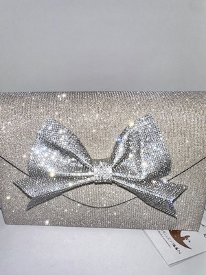 Silver evening clutch with sparkling bow, new