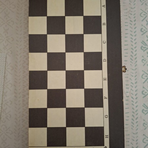 Backgammon and chess board used, missing chess pieces