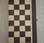 Backgammon and chess board used, missing chess pieces