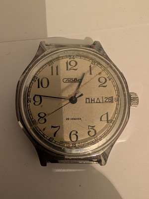 Slava vintage Soviet mechanical wristwatch with date and day window