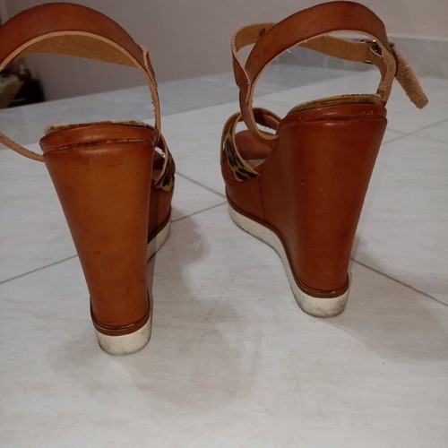 Tan platforms with animal print used, size 38