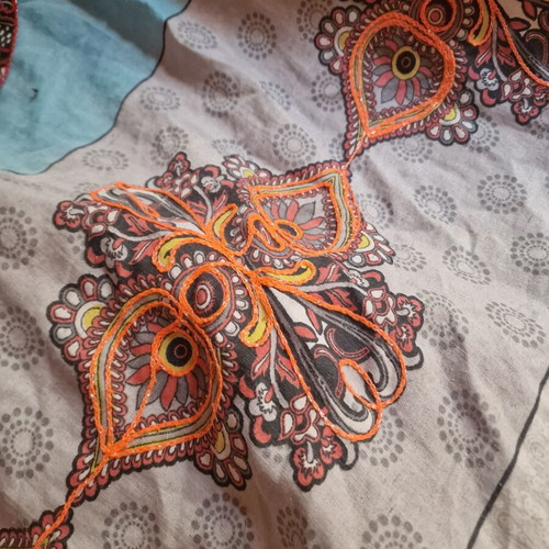 Throw from India used with hand-stitched colorful animal motifs