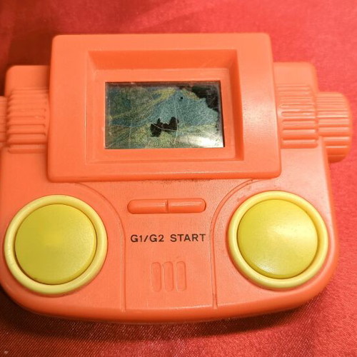 Vintage 80s LCD game with screen blemishes