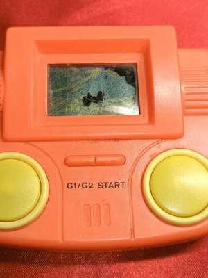 Vintage 80s LCD game with screen blemishes