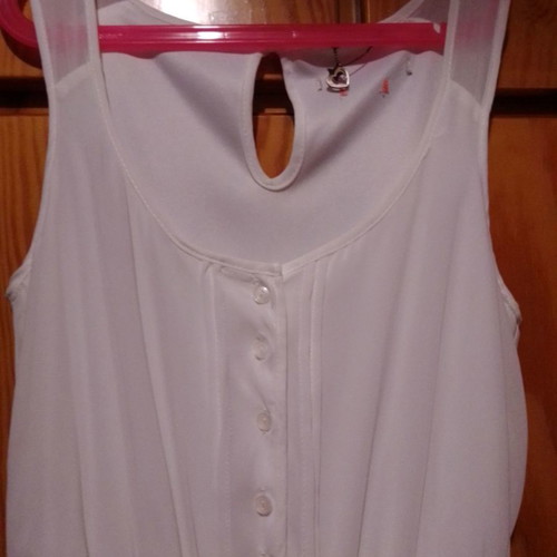 Two white dresses used, sizes 12-14 for girls