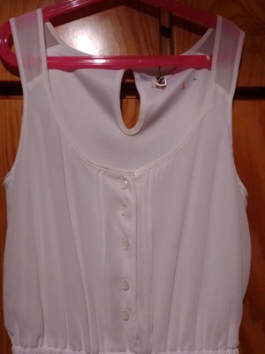 Two white dresses used, sizes 12-14 for girls