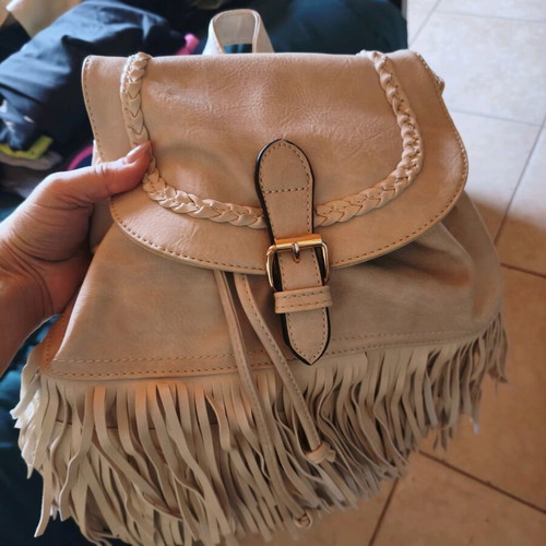 Backpack like new beige with fringe