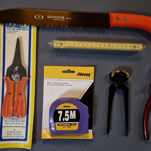 Set of 6 tools new with tape measure, scissors, saw, folding ruler, pliers and cutter