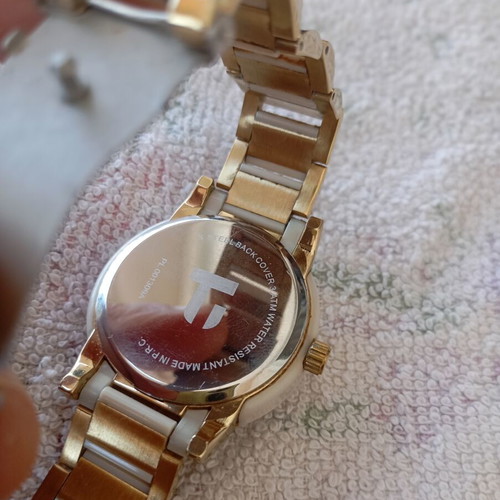 Pacoloren women's watch like new with white ceramic bracelet and gold details