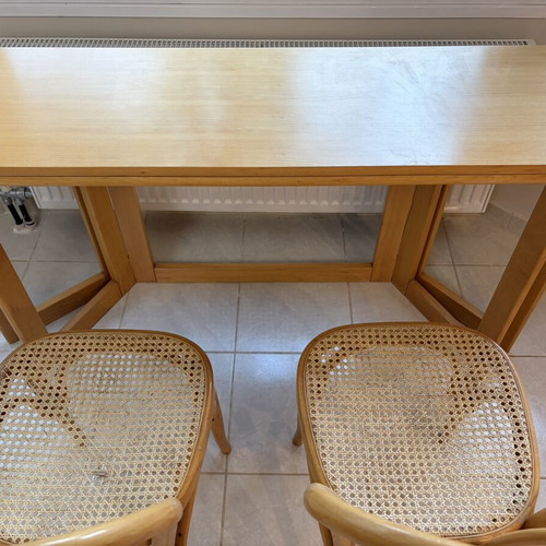 Multifunctional table with two used Viennese wicker chairs