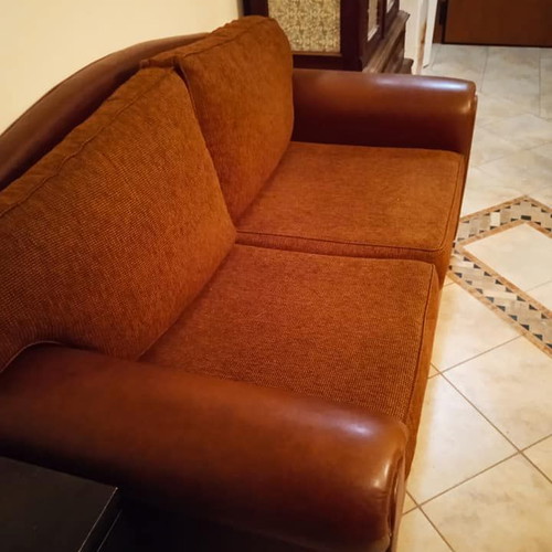 Two-seater sofa used, leatherette with fabric