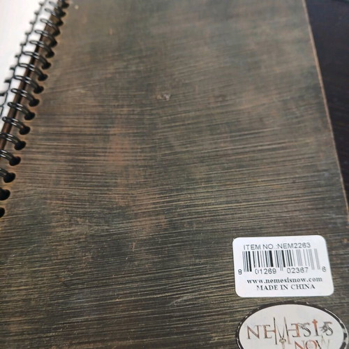 Iron notebook like new with embossed designs and magnet