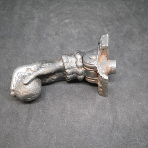 Antique iron door knocker used, made of cast iron