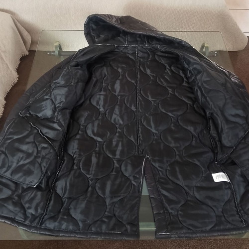 Long women's quilted black jacket like new
