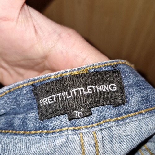 Pretty Little Thing blue denim skirt used, short with rips size 44