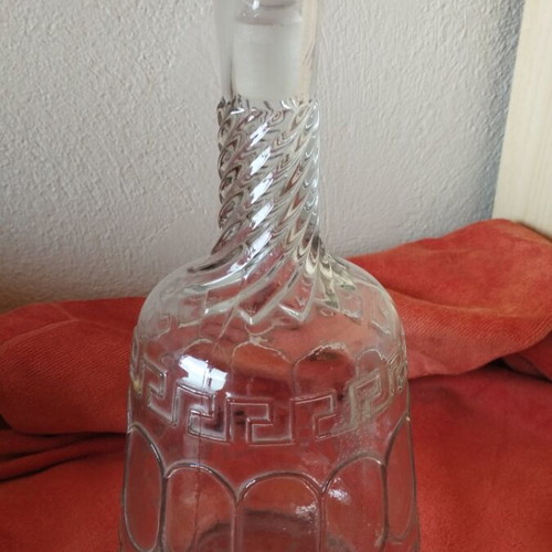 Glass wine carafe used with meander design