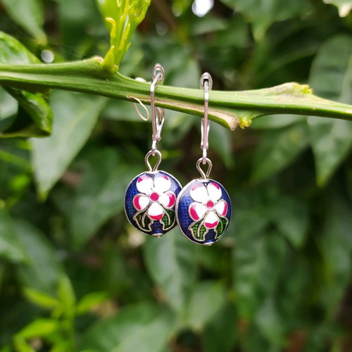 Handmade earrings used with metal elements and enamel