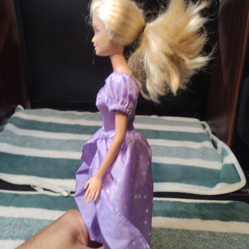 Barbie with lilac dress used, torn shoulders