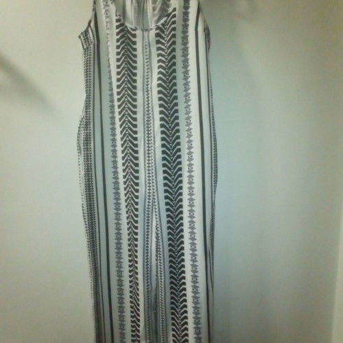 One-piece jumpsuit size S with slanted pockets and belt