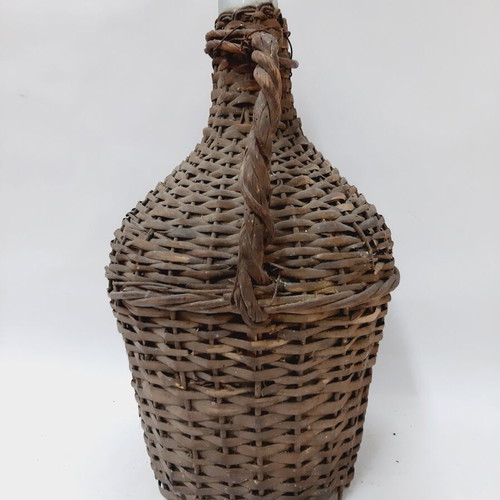 Dame-Jeanne vintage demijohn bottle used, glass with wicker