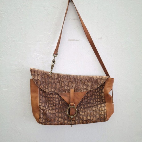 Vintage cowboy leather shoulder bag with metal accents like new