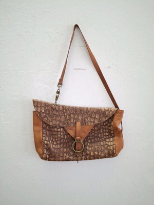 Vintage cowboy leather shoulder bag with metal accents like new