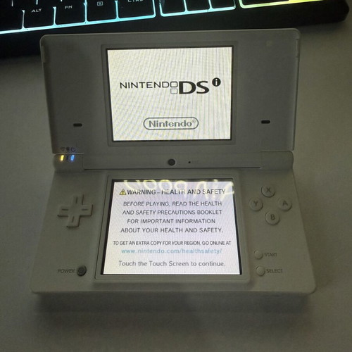 Nintendo DSi used with 1 game and 1 charger