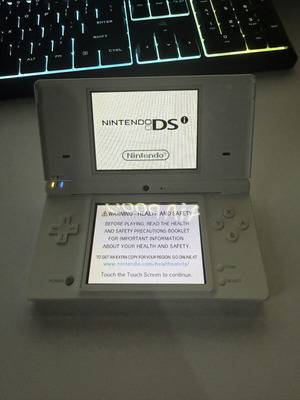 Nintendo DSi used with 1 game and 1 charger