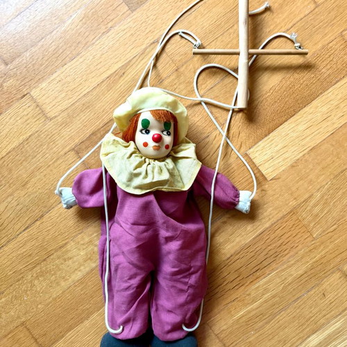 Vintage clown marionette with porcelain head and wooden control cross, like new