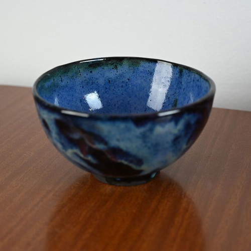 Ceramic bowl used with blue glazed surface