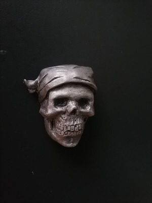 Handmade magnet from white cement with acrylics and metallic spray