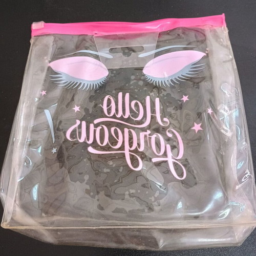 Transparent pink toiletry bag used