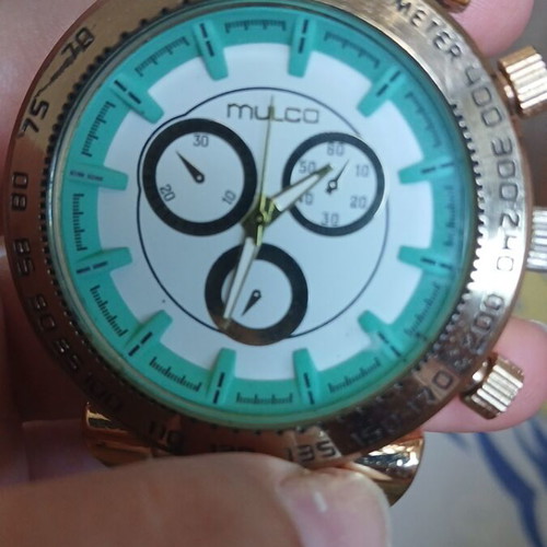 Mulco wristwatch turquoise and gold, used with minor wear