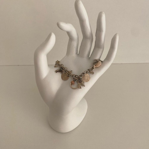 Accessorize bracelet with charms in pink and gold, like new