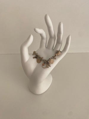 Accessorize bracelet with charms in pink and gold, like new