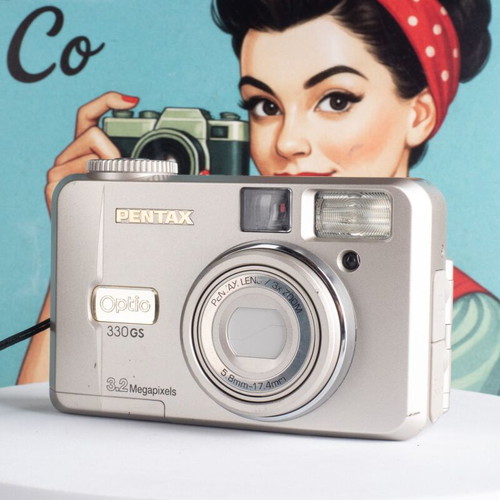 Pentax Optio 330GS 3.2MP vintage digital camera used with flip-up screen