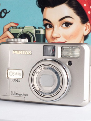 Pentax Optio 330GS 3.2MP vintage digital camera used with flip-up screen