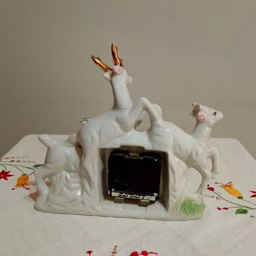 Vintage decorative tabletop figurine with clock used