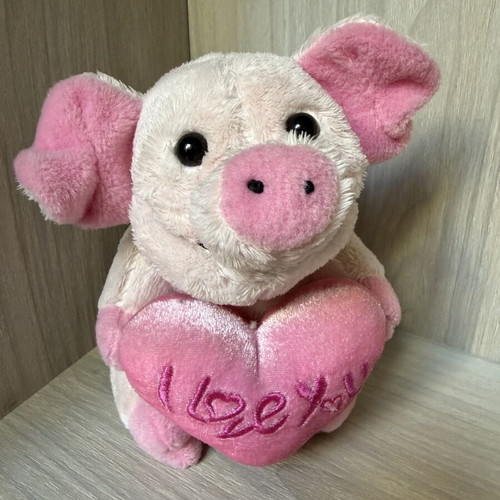 Small pink plush pig toy