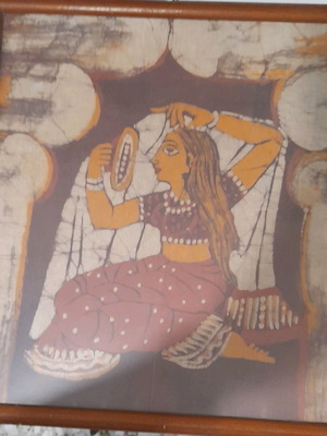 Indian batik used with girl combing hair, bathroom decoration