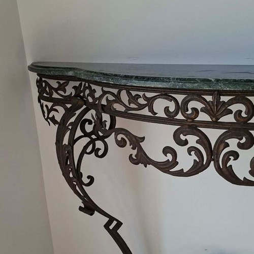 Metal console used with marble top and ornate wrought iron design