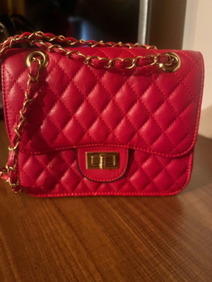 Red quilted shoulder bag like new with gold details