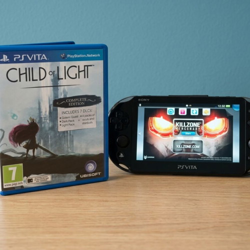 Sony PS Vita Slim console with 8GB card and games