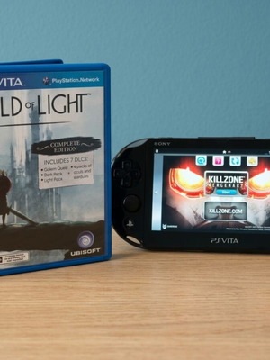 Sony PS Vita Slim console with 8GB card and games