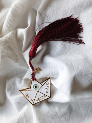 Handmade lucky charm with metal elements and tassel made to order