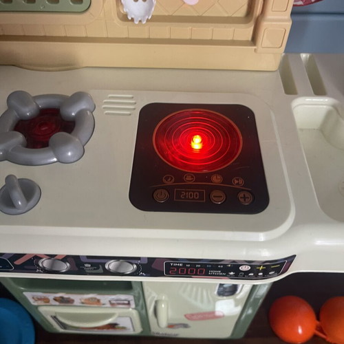 Children's play kitchen with many accessories